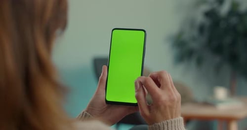 Woman Doing Swipe Up on Chroma Key Screen of Mobile