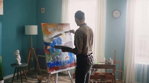 Artist Painting Abstract Art in Studio