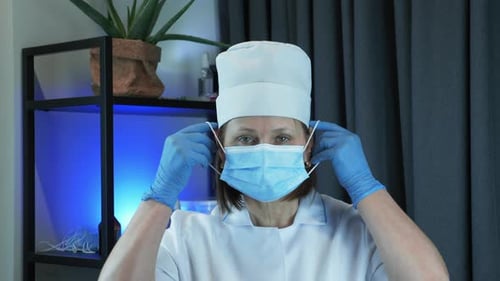 Medical Professional Putting on Surgical Mask