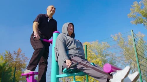 Couple Exercising Outdoors on Sunny Day