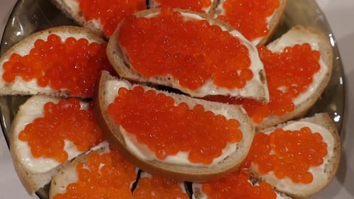 Red Caviar Sandwiches on a Plate Close Up