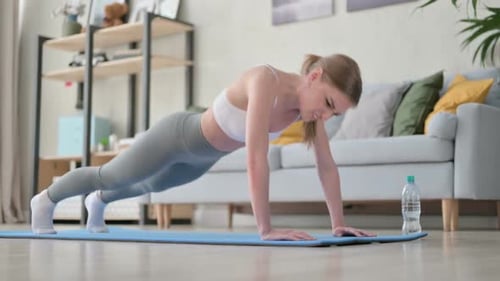Woman Exercises at Home, Exhausted After Pushups