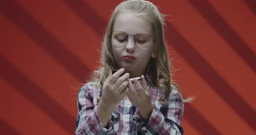 Girl Eats Oreo Cookie in Mid Shot