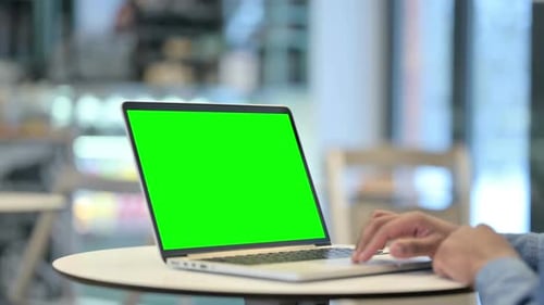 Man Using Laptop with Green Chroma Key Screen Close Up