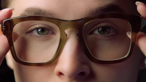 Marco of Businesswoman Face Wearing Glasses in Office