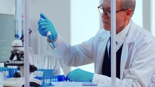 Scientist Working in Brightly Lit Laboratory with Equipment