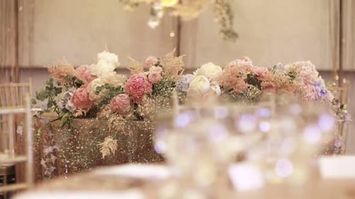 Wedding Table Decorated with Flowers and Lights