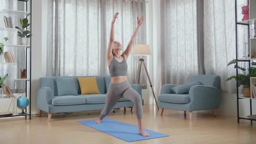 Asian Athletic Female Exercising, Stretching And Practicing Yoga At Home. Healthy Lifestyle