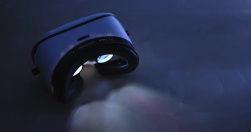 Illuminated VR Headset on a Dark Surface