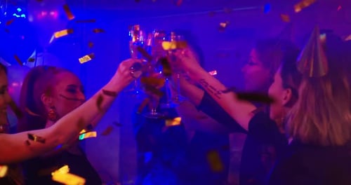 Women Celebrating Birthday with Champagne and Confetti