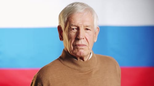 Serious Mature Man Looking Into the Camera