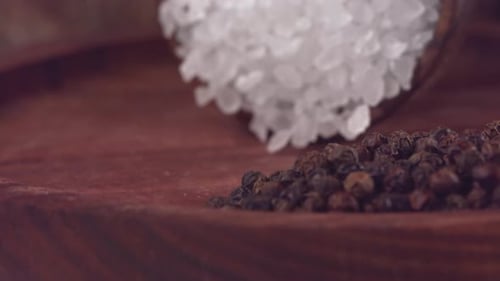 Coarse Salt and Peppercorns Close Up Shot