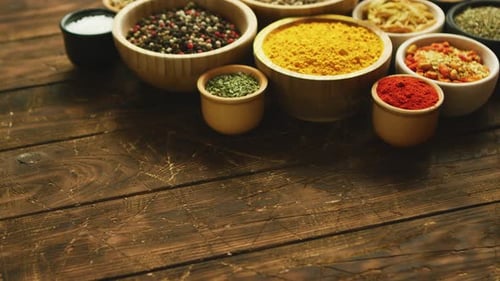 Assorted Spices in Bowls on a Wooden Surface