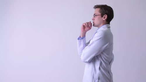 Profile View of Young Handsome Man Doctor Thinking