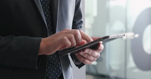 Businessman using digital tablet in office 4k