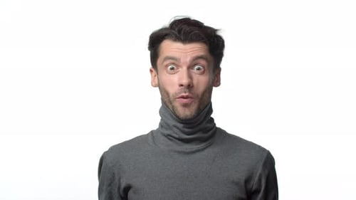 Excited Man Reacts with Surprise and Joy