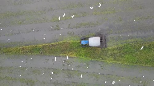 Top down view tractor plowing