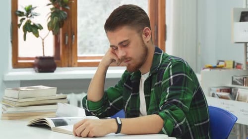 Tired Guy Falls Asleep While Studying