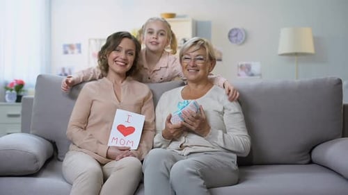Family Celebrates Birthday with Homemade Card and Gift