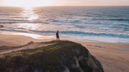 Man Standing On The Cliff