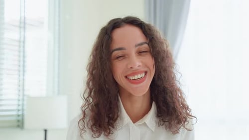 Smiling Young Woman Portrait in Bright Indoor Setting