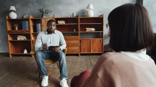 Therapist Consulting with Woman in Counseling Session
