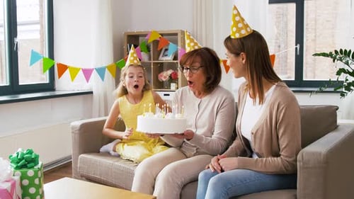 Family Celebrates Birthday with Cake and Festive Cheer
