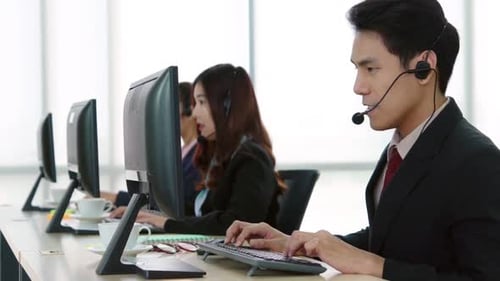 Business People Wearing Headset Working in Office