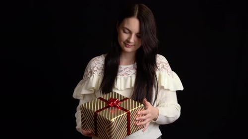 Woman Holding Beautifully Wrapped Birthday Gift