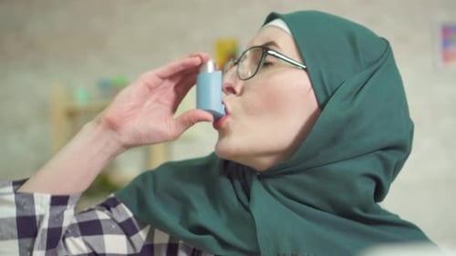 Adult Woman Using Inhaler Close Up