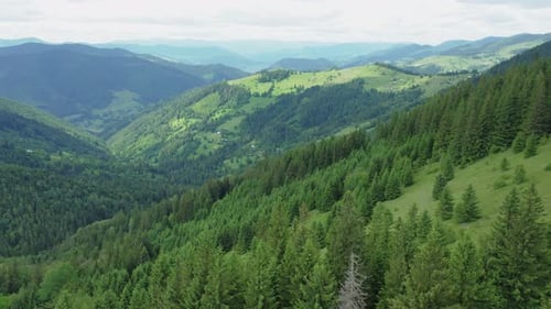 Aerial Drone View of a Mountain Landscape Against a Cloudy Sky on a Summer Day