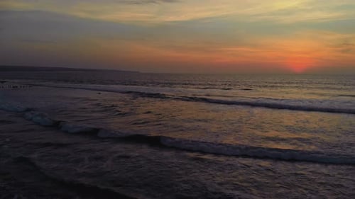 Flight at Sunset Overlooking the Indian Ocean in Bali Indonesia