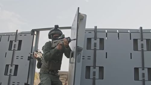 Slow motion of soldiers training in close quarters combat