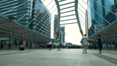 City traffic. Bodies move about their business. Timelapse