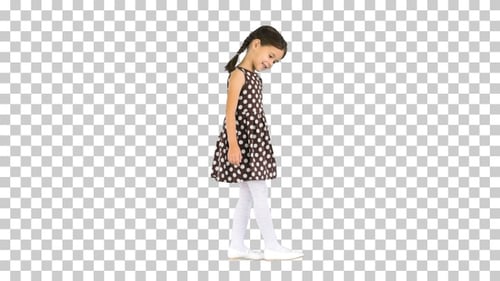 Shy little girl in polka dot dress waving, Alpha Channel