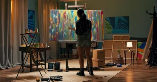 Artist Painting Abstract on Canvas in Studio