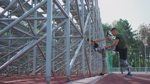 Two people stretching their legs
