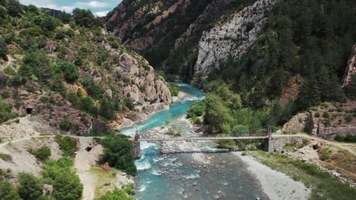 River in mountainous valley on sunny day