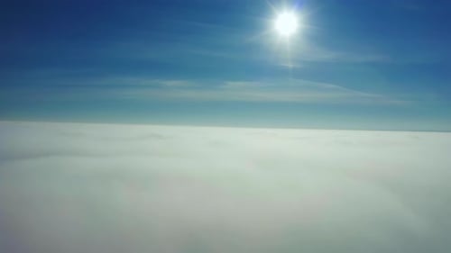 Aerial Drone View. Flying Ower Clouds and Descent Into the Clouds.