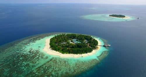 Aerial drone view of scenic tropical islands in the Maldives.