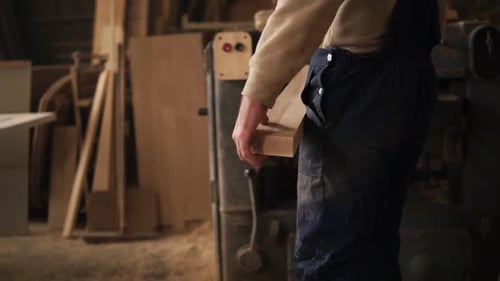 A Man Works in a Carpentry Shop