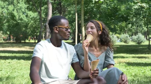 Couple Enjoying Ice Cream in the Park Together