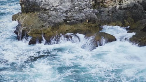 Raging Turquoise Sea Waves Breaking Over Big Wet Rock at Black Sea Coast