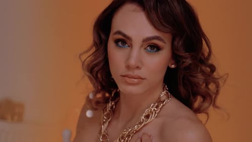 Close Up of Woman Wearing Gold Chain Necklace