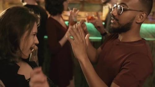 Happy Young Adults Dancing at an Urban Bar