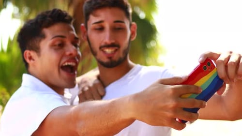 Happy Gay Couple Spending Time Together in Sunny Day in Green Park