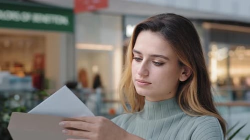 Woman Opens Letter Indoors