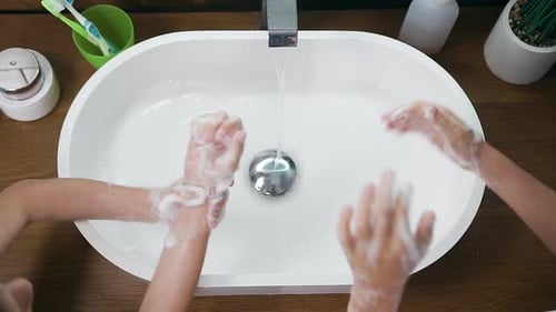 Children Handwashing with Soap and Running Water