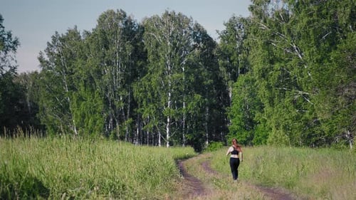 Woman running in the forest