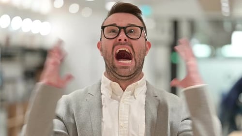 Man Reacts by Screaming in an Office Environment